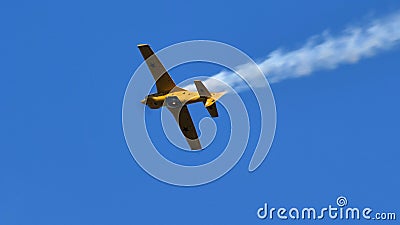 Airplane performs stunts in the sky. Aerial acrobatics is an extreme sport Editorial Stock Photo