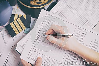 Airplane pilot filling in flight plan Stock Photo