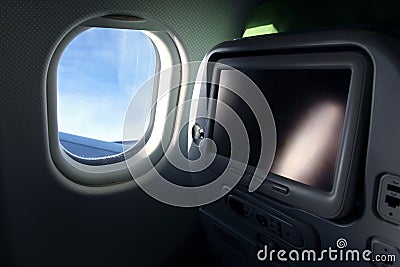 Airplane seat with tv screen Stock Photo