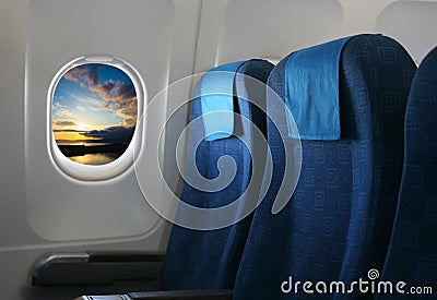 Airplane seat and window Stock Photo