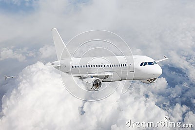 Airplane in the sky glides in the clouds flight journey. Passenger commercial aircraft. Stock Photo