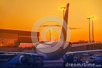 Airplane at sunset Stock Photo