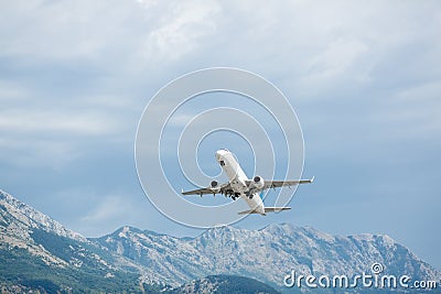 Airplane take off. Mountains view. Stock Photo