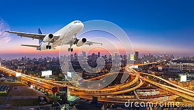 Airplane take off over the panorama city at twilight scene Stock Photo