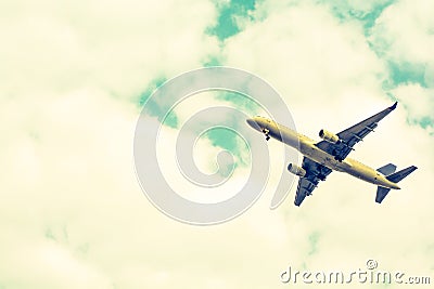 Airplane take-off from runways at cloudy sky.Color sepia Stock Photo