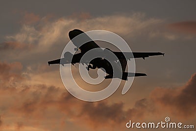 Airplane take off on sunset from airport Editorial Stock Photo