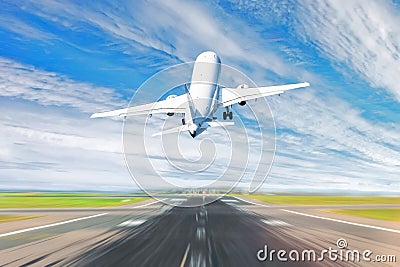 Airplane taking off from the airport - back view. Stock Photo