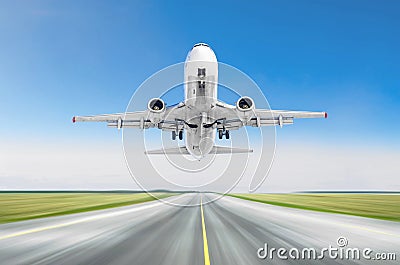 Airplane taking off from the runway airport sky blue. Stock Photo