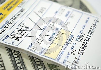 Airplane ticket and dollars Stock Photo