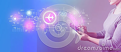 Airplane travel theme with woman using a tablet Stock Photo