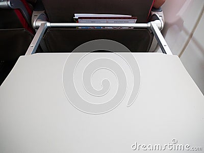 Airplane Tray Table Opened in Passenger Seat Stock Photo