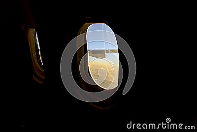 Airplane window fisheye lens at sunset Stock Photo