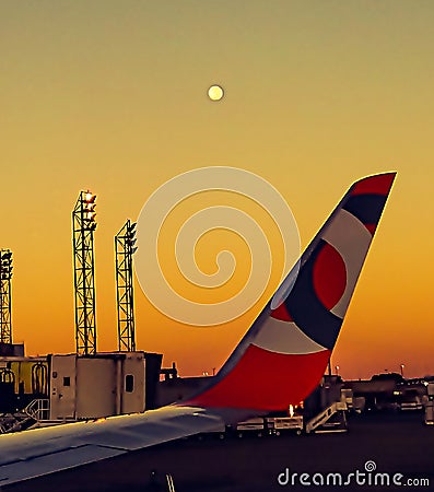 The airplane wing with a blurred moon. Editorial Stock Photo