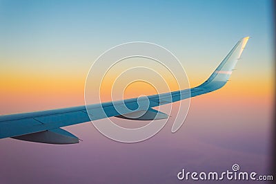 Airplane wing during an incredible sunset Stock Photo