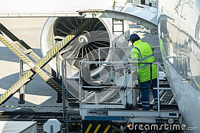 Transport and logistic concept by plane for logistic Import export - Loading platform of air freight to the aircraft, Cargo man on Editorial Stock Photo