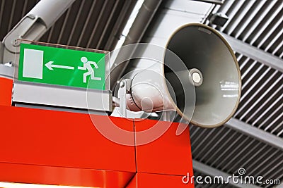 Airport emergency exit sign and public address system. Stock Photo