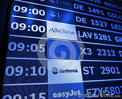 Airport information board close-up in modern Spanish Europe Airp Editorial Stock Photo