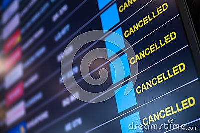 Flights cancelled on information time table board in airport Stock Photo