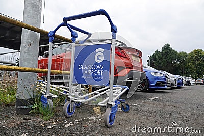 Airport luggage trolley abandoned in car park Editorial Stock Photo