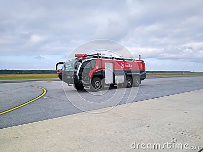 The airport rescue and firefighting vehicle is located on the apron at the Warsaw Modlin airport Editorial Stock Photo
