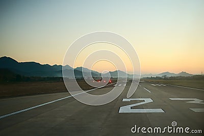 Airport runway at dawn. Travel, air transport, aeronautical industry concept Stock Photo