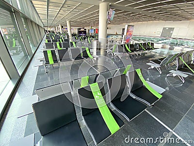 Airport seats during Covid 19 pandemic. Social distancing Editorial Stock Photo