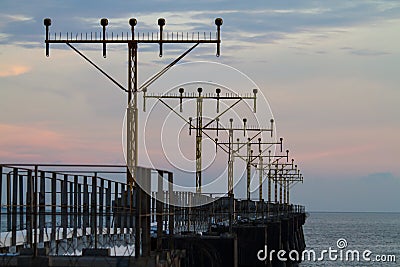 Airport signal lights on the sea Stock Photo
