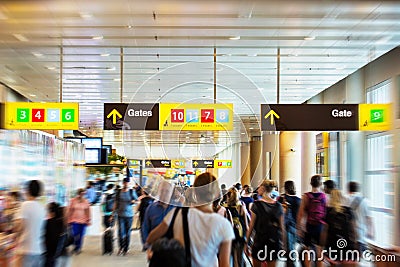 Airport terminal with people hurrieng to the gates Editorial Stock Photo