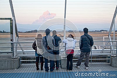 Airport visitors watch Shinmoedake volcano erupt Editorial Stock Photo