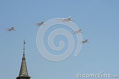 The airshow on the Red Square. Group of supersonic bombers-missile Tu-22M3 Backfire led by supersonic bomber-missile Tu-160 Editorial Stock Photo