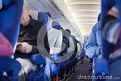 Aisle between seats in airplane cabin Editorial Stock Photo