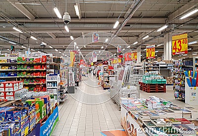 aisle with shelves from the Auchan hypermarket Editorial Stock Photo