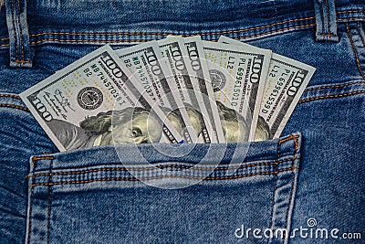 100 dollar bills in the pocket of blue jeans, studio shooting Stock Photo