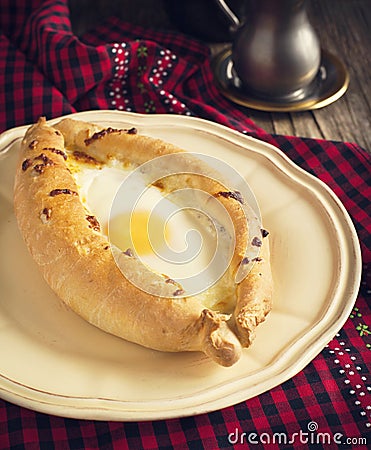 Ajarian khachapuri - traditional dish of georgian cuisine. Stock Photo