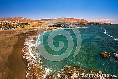 Ajuy beach with vulcanic mountains on Fuerteventura island Stock Photo