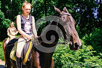 Akhal-Teke horse. Muzzle thoroughbred Akhal-Teke horse, photo outdoors. Ridden by a young rider. Saint-Petersburg. Russia. 06.18. Editorial Stock Photo