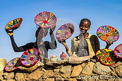 Aksum, Ethiopia - Feb 09, 2020: Ethiopian girls selling baskets in the Aksum basket market in Aksum Editorial Stock Photo