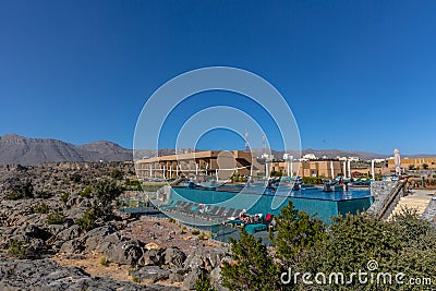 Al Jabal, Oman - Jan 22nd 2018 - The open swimming pool of the Anantara hotel in Al Jabal in Oman in a blue sky day. Editorial Stock Photo