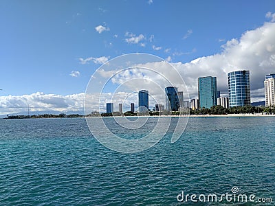 Ala Moana Beach Park with office building and condos in the background Stock Photo