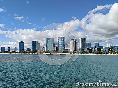 Ala Moana Beach Park with office building and condos in the background Stock Photo