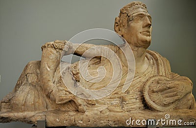Alabaster lid of cinerary urn with a figure of a reclining man at the British Museum in London Editorial Stock Photo