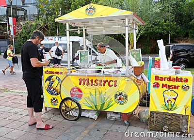 Unidentified Tourist buying Corn from a Vendor in Alanya, Antalya, Turkey Editorial Stock Photo