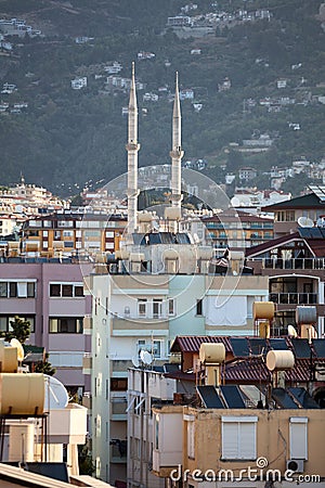 The Alanya cityscape with minarets of mosque and residential houses in center of city. Antalya Province, Turkey Stock Photo