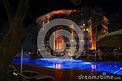 Alanya - Turkey - JUL 01, 2021: Hotel Utopia Resort and Residence night view. Resort pool at dusk. Editorial Stock Photo