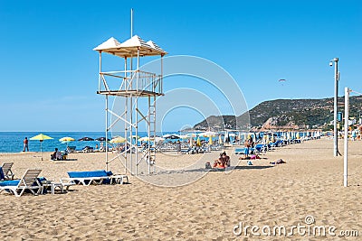 Rescue tower at Kleopatra Beach in Alanya. Beautiful tropical landscape with sun loungers, Editorial Stock Photo