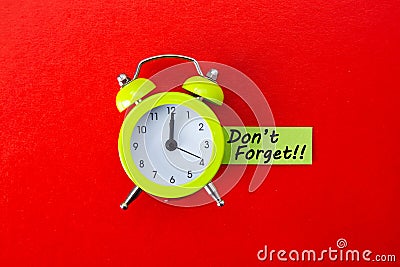 Alarm clock with Don`t Forget word on red background Stock Photo