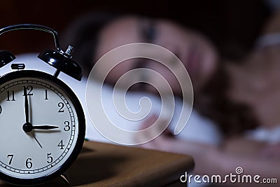 Alarm clock on night table Stock Photo