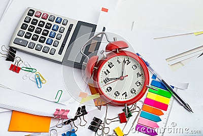 Alarm clock, over pile various documents, Deadline business and finance concepts Stock Photo