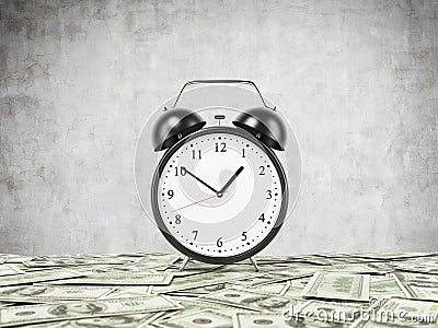 An alarm clock is settled on the surface which is covered by dollar notes. Concrete background. Stock Photo