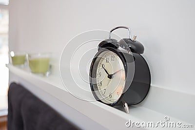 Alarm clock on a shelve Stock Photo